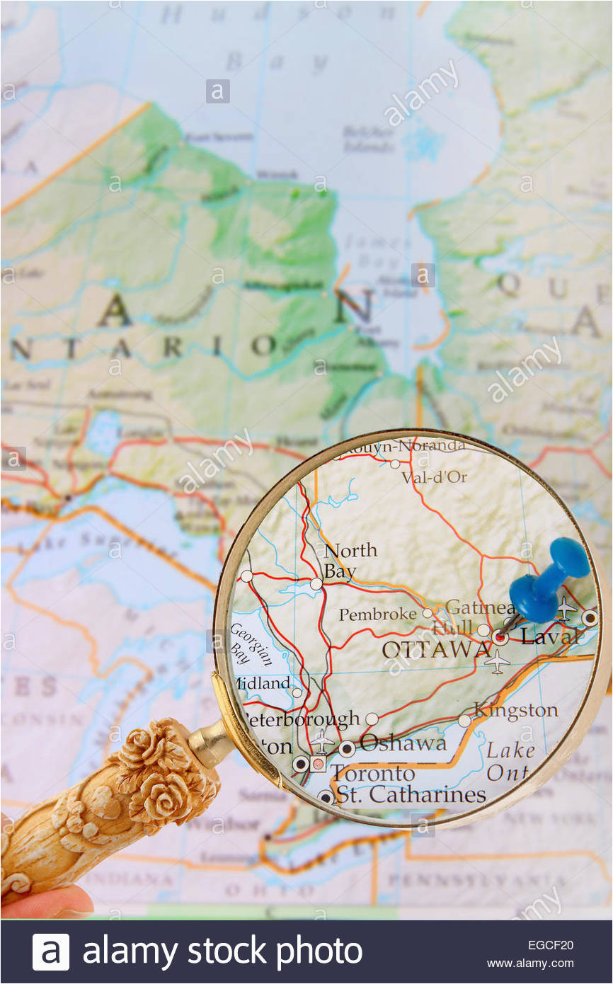 blue tack on map of ontario with magnifying glass looking in on